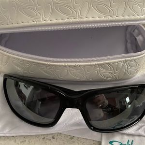 Never worn Oakley sunglasses with sheath and case.